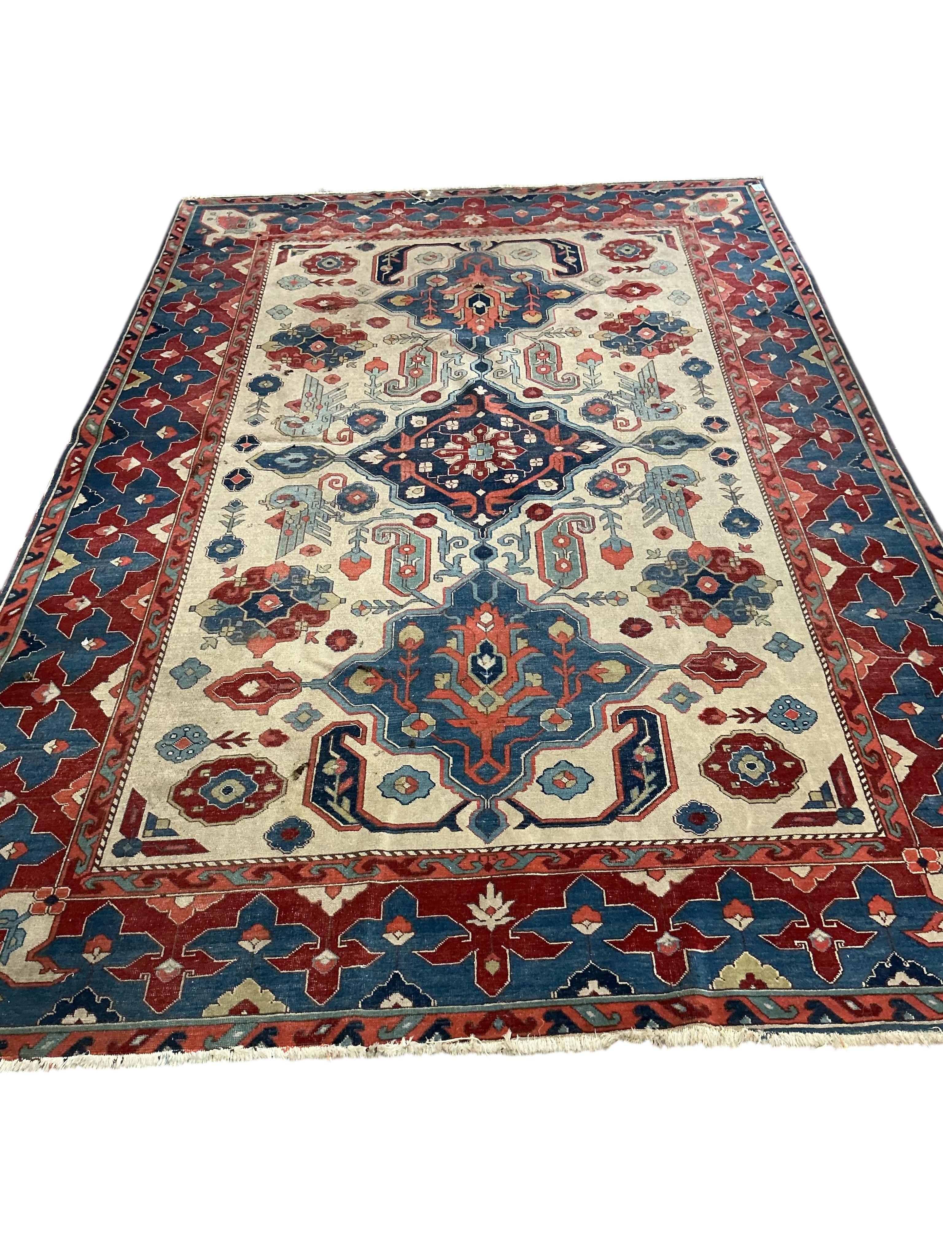 A Persian ivory ground Shirvan style carpet, approximately 300 x 198cm